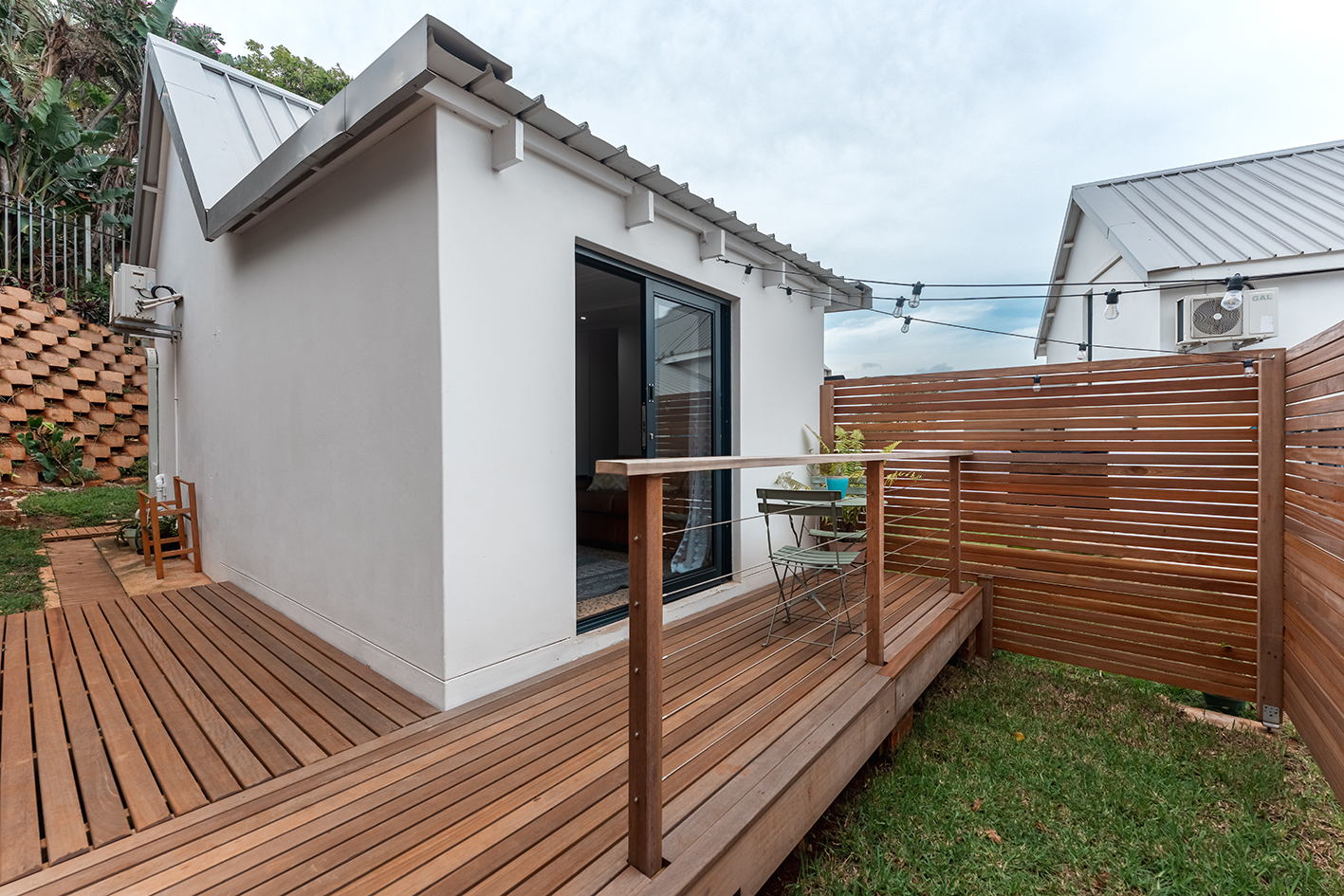 Private outdoor deck off the living room at a coastal cottage in Dolphin Coast near Ballito